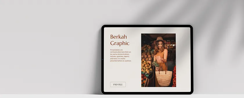 Tablet showing a design book cover and photo, angled against a light gray surface.